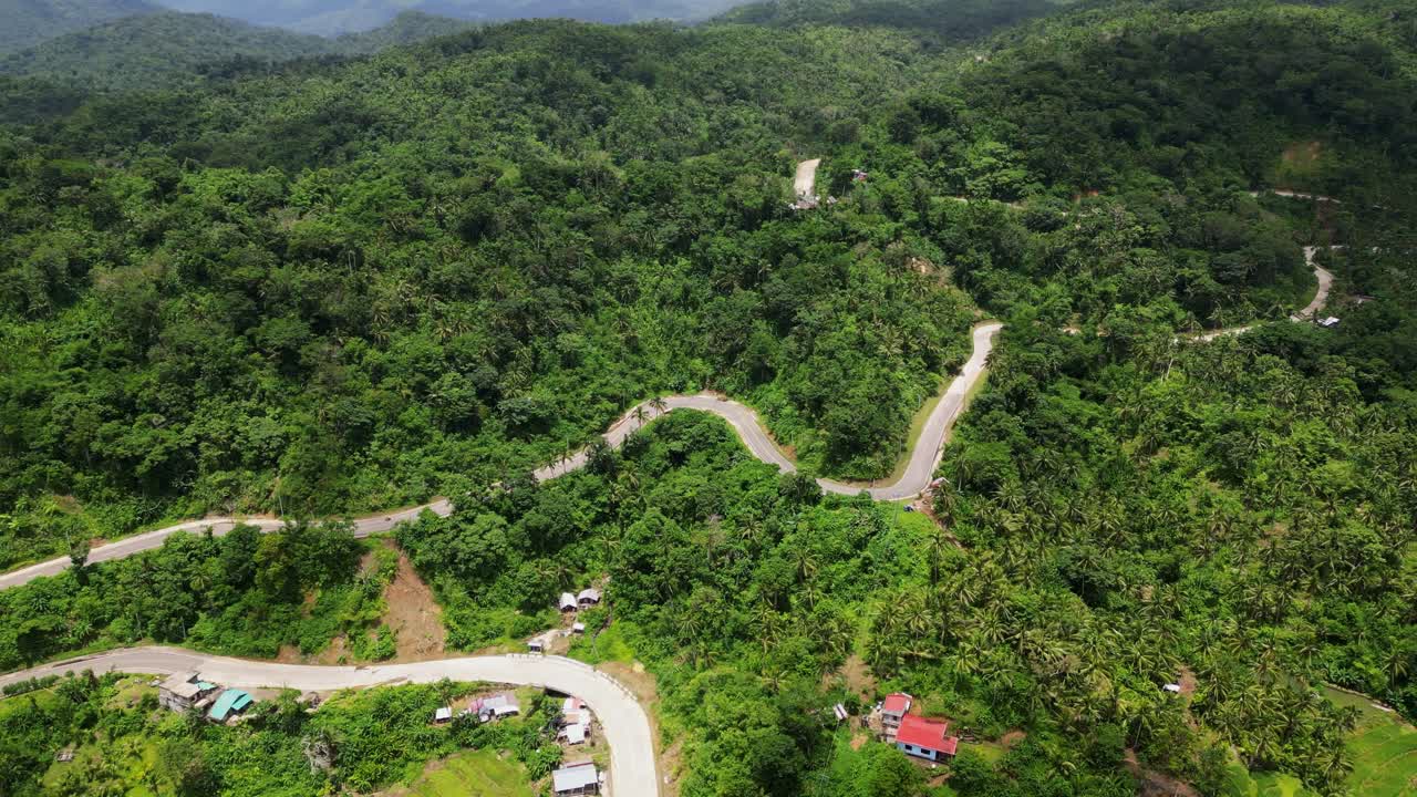 A Winding Road On Forested Mountains Near Bato Town In Catanduanes, Philippines. Aerial Drone Shot