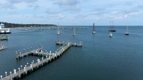 sailboats anchored near the jetty in vineyard heaven pier in cape cod, ma, usa