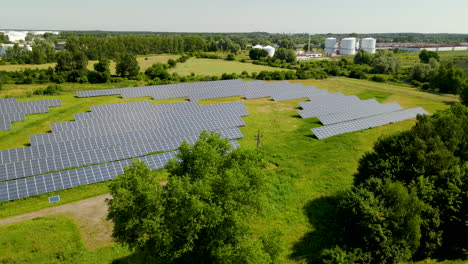 aerial view above industrial solar panel farm green renewable energy in rural field