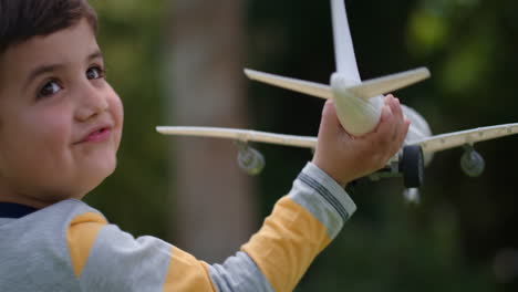 little-boy-playing-with-toy-airplane-happy-child-playing-game-running-imagining-travel-freedom-having-fun-outdoors-in-sunny-park-enjoying-childhood-4k