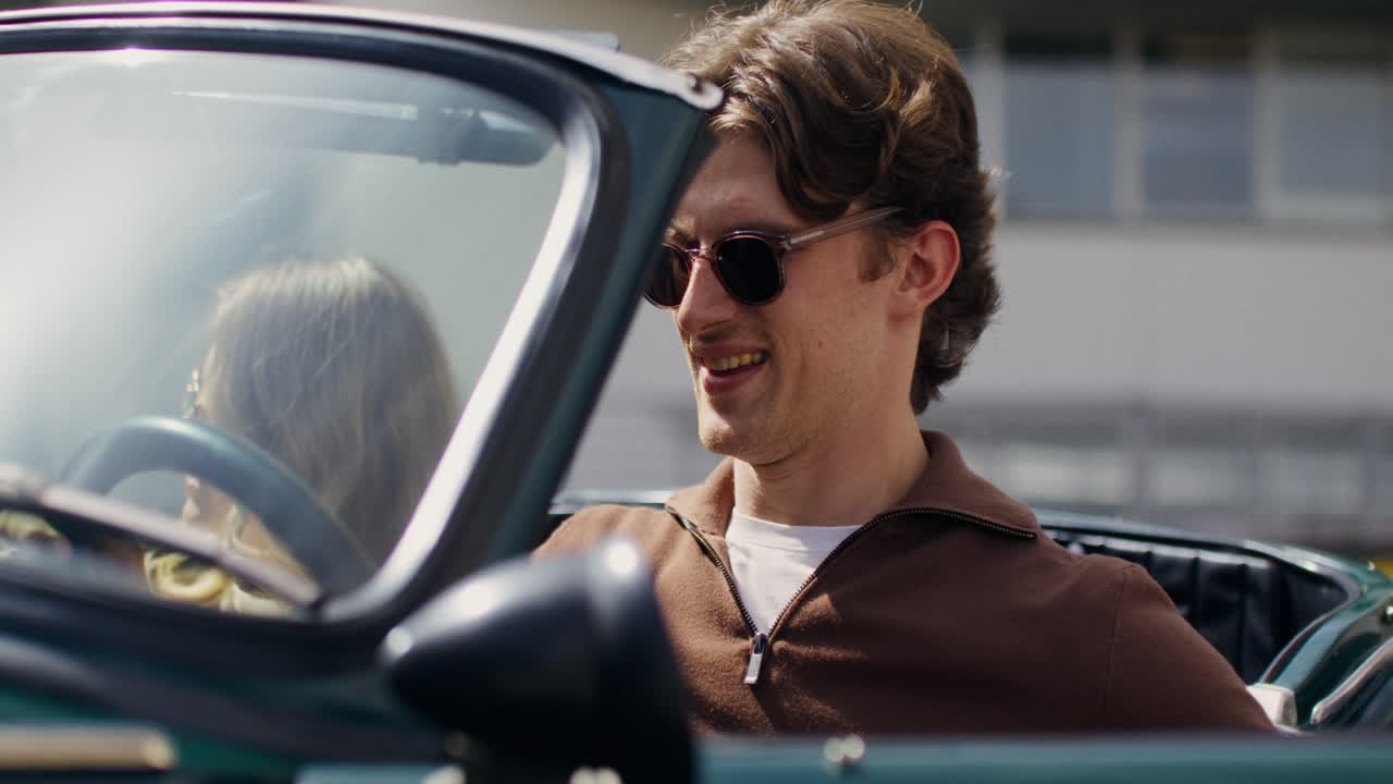 Couple Enjoying a Scenic Drive in a Vintage Convertible