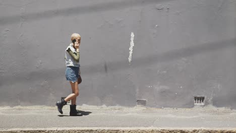 mixed race woman walking on street