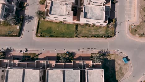 aerial birds eye shot of empty road at bahria town housing estate