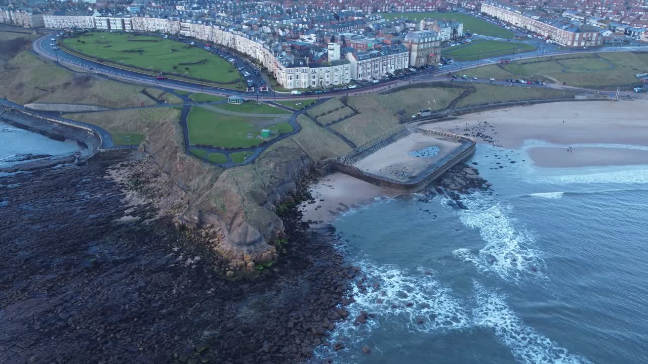 Aerial view of Tynemouth coast, Longsands beach and gentle waves on a quiet morning - Newcastle