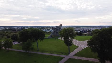 Flying-away-of-Memorial-of-the-Victims-of-Nazism-at-the-Ninth-Fort-of-Kaunas-city,-Lithuania