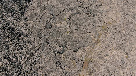 looking down at mossy lava field, zoom out