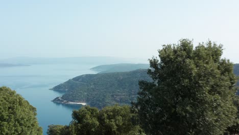 aerial: croatian coastal reveal over island of cres hilltop, adriatic sea