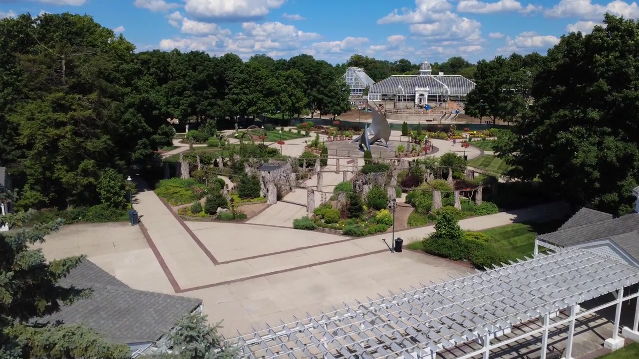 Franklin Park Conservatory in Columbus, Ohio showcases lush indoor plant biomes, vibrant botanical gardens and seasonal floral displays.