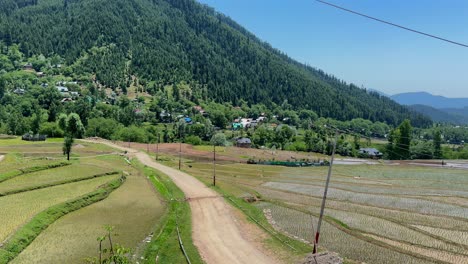 beauty of rural india and farmers land, nature beauty, hills, green fields with village life in forest area and timeless travel escapes