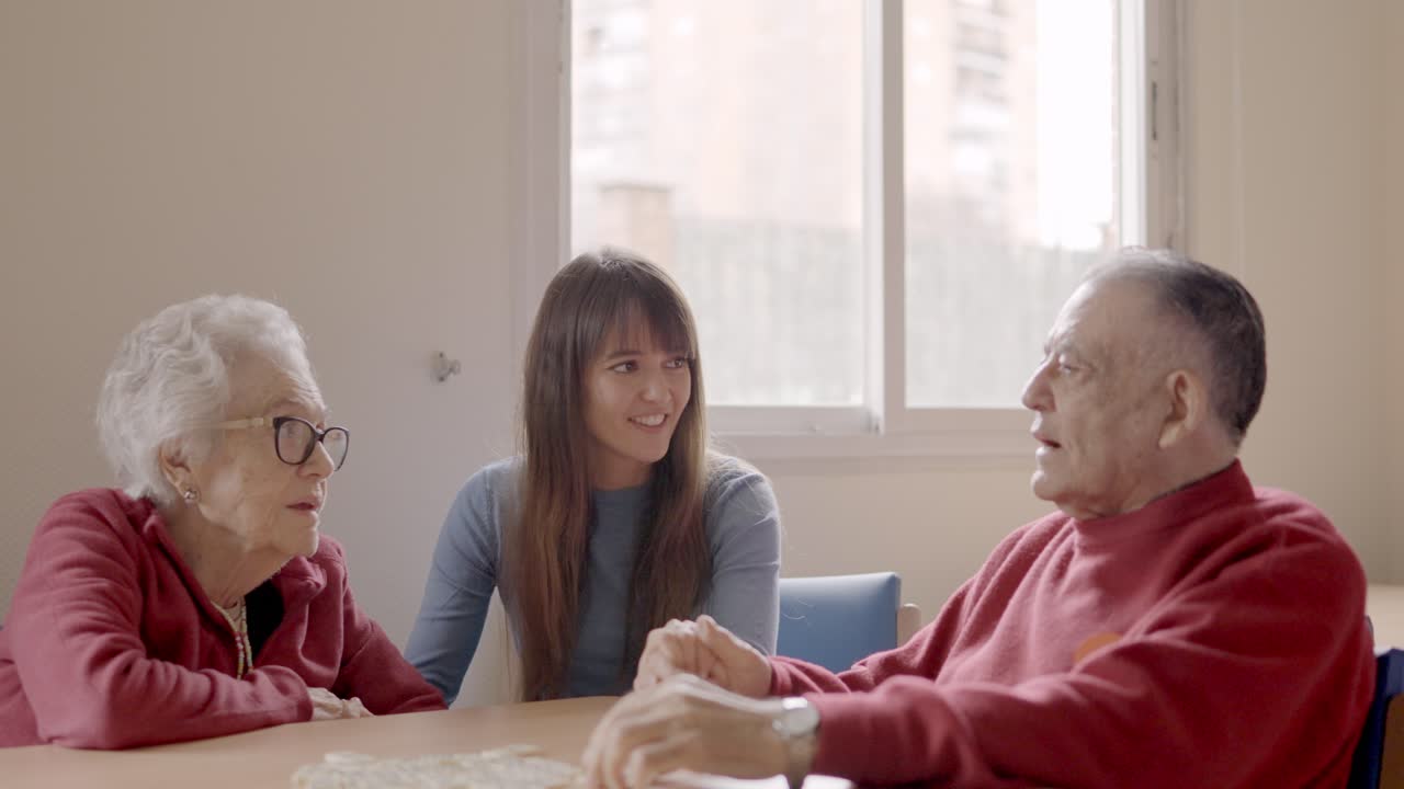 Grandfather talking with the family during a visit in geriatric