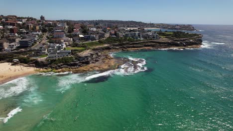 idyllic scenery of tamarama beach in sydney, nsw, australia - aerial pullback