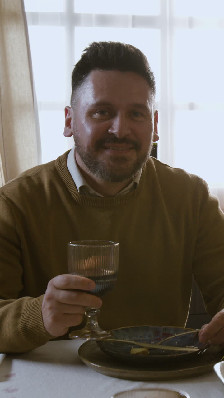 Man drinking wine at dinner