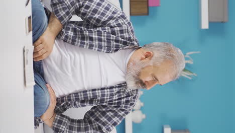 Vertical-video-of-Nervous-old-man-stressed-and-thoughtful.