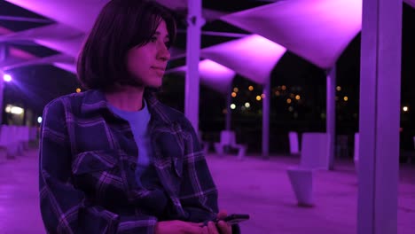 Smiling-girl-in-night-sitting-outside