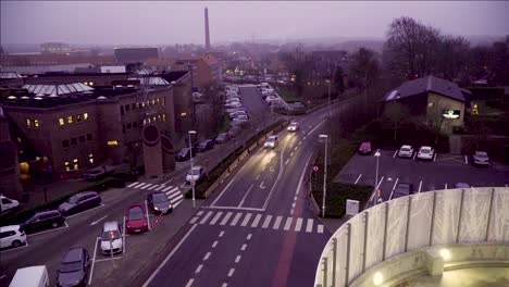 timelapse of early hazy morning traffic and workers while the sun starts to light everything up