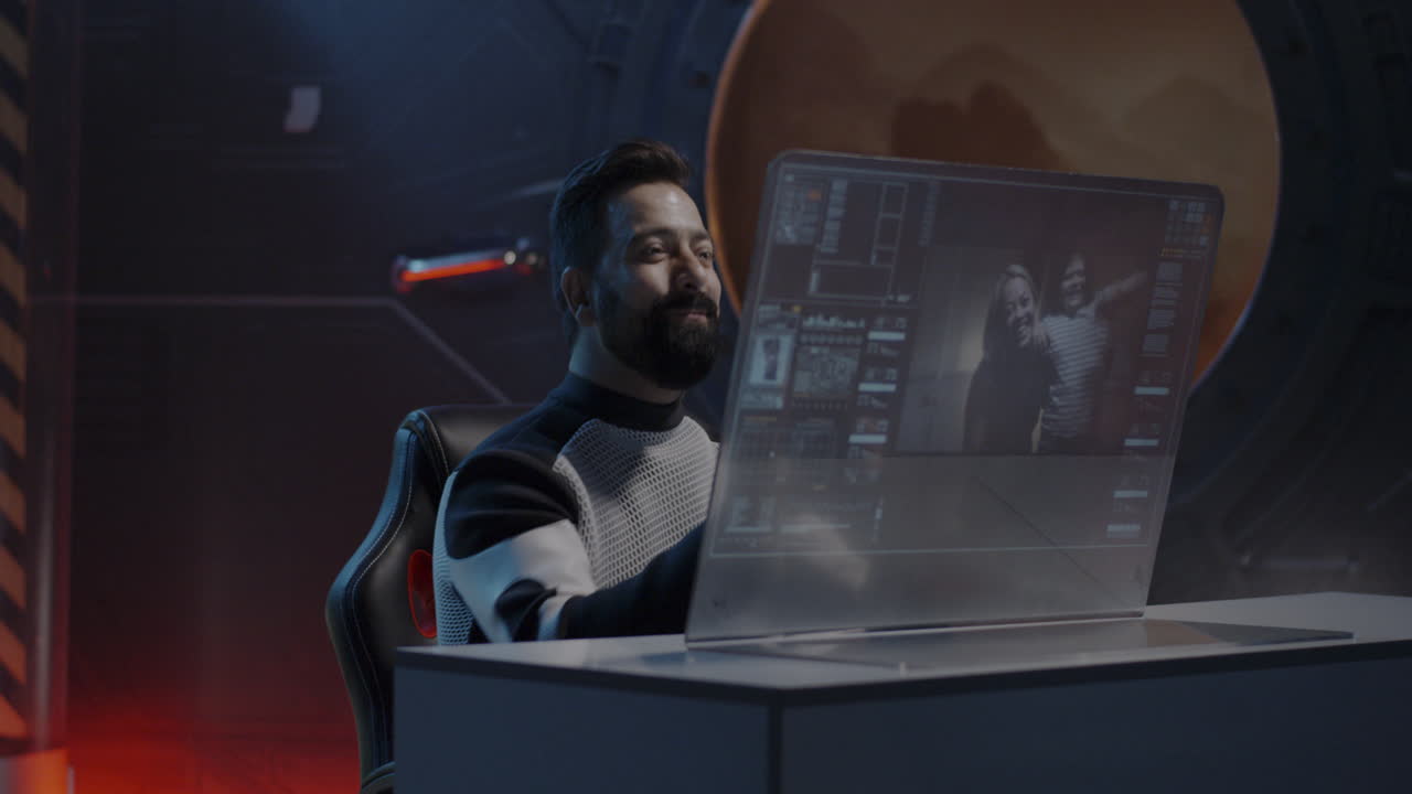 Man in Spacesuit Viewing Video Call on Futuristic Computer