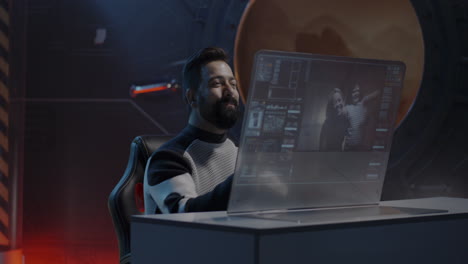 man in spacesuit viewing video call on futuristic computer