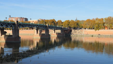 saint-pierre of toulouse bridge over garonne river in sunny autumn day, france