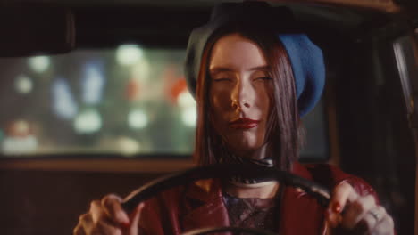 portrait of young attractive lady driving vintage car at night