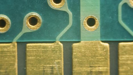 pcb circuit board soldering gold plated contacts connections under microscope