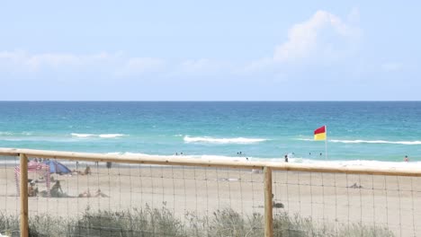 scenes of a beach with varying cloud cover and waves