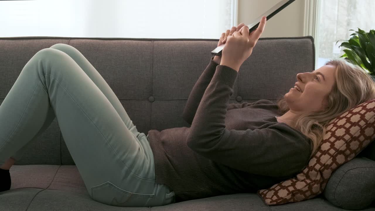 Gorgeous young blonde woman talking on a video call