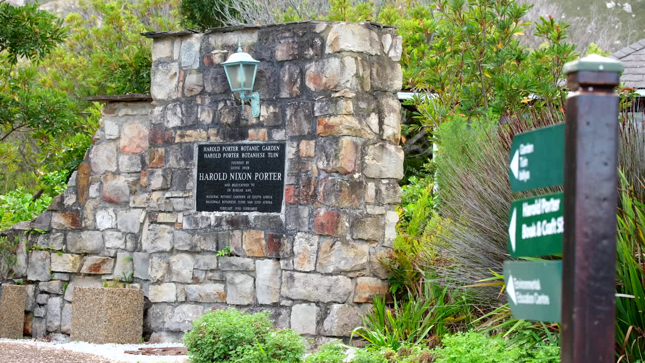 Entrance sign to Harold Porter Botanical Garden set in stone wall, Betty's Bay