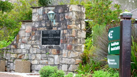 entrance sign to harold porter botanical garden set in stone wall, betty's bay