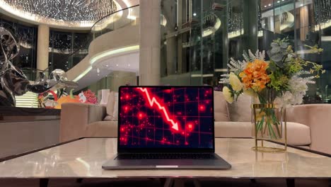 Laptop-Inside-Luxurious-Home-Displaying-Red-Arrow-Indicating-Stock-Market-Losses-in-Bear-Market,-Caused-By-Recession