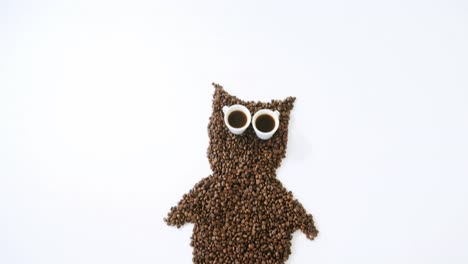 Coffee-beans-and-cups-forming-owl