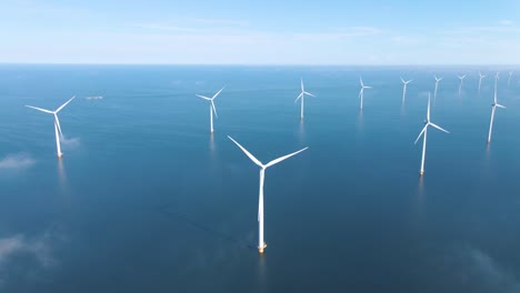 huge windmill turbines, offshore windmill farm in the ocean westermeerwind park , windmills isolated at sea on a beautiful bright day netherlands flevoland noordoostpolder