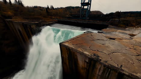 powerful waterfall at damaged dam