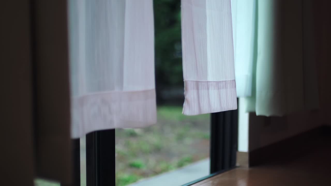 Wind Blowing Through The White Curtain From The Window Of A Japanese Household In Tokyo, Japan.  - static shot