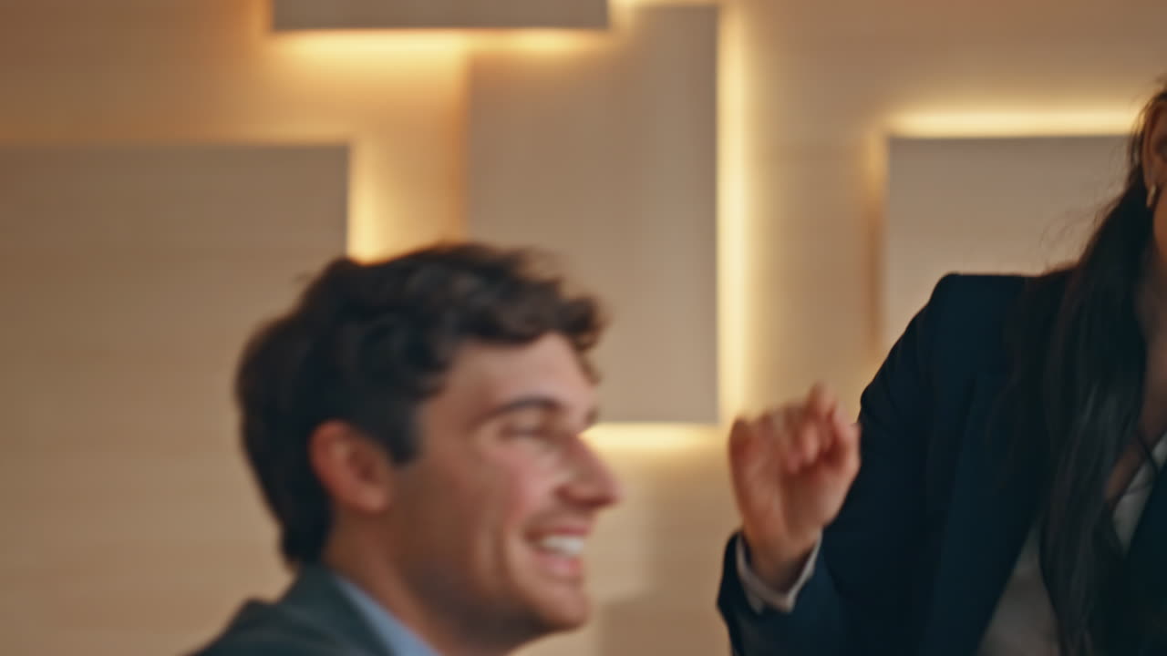 Surprised couple rejoicing business project results at buro closeup. Joyful team