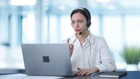 Indian-call-center-girl-talking-to-customer-through-video-call