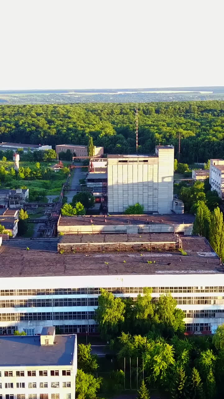 Old Factory Buildings. Industrial of an old white factory building Vertical video