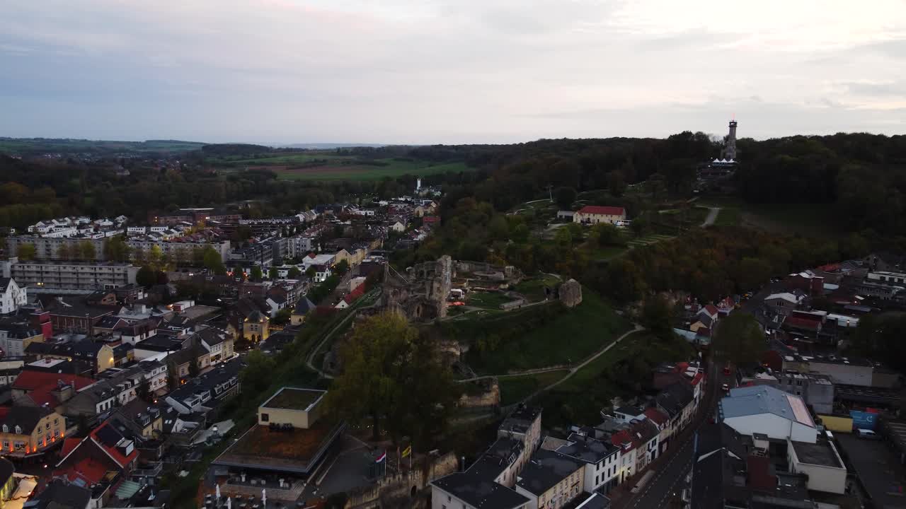 Castle ruins of Valkenburg after sunset, aerial drone view