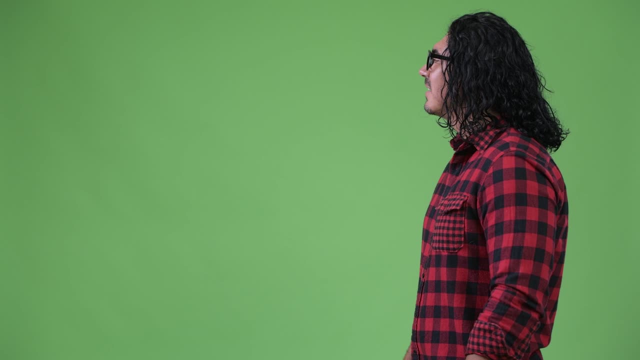 Profile view of handsome hipster man smiling