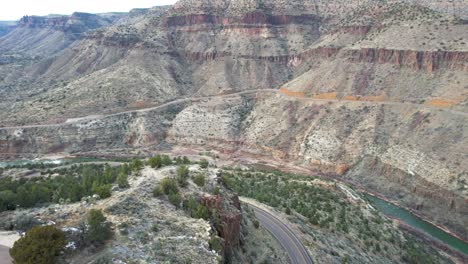 Salt-River-Canyon-Arizona-with-road-down-to-river-and-cliffs--aerial