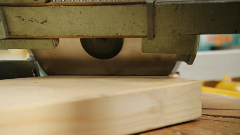 close-up view of wood cutting by a big machine in the wood factory