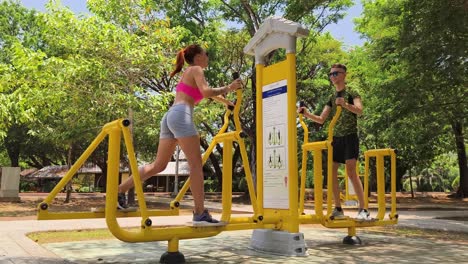 couple working out at outdoor gym