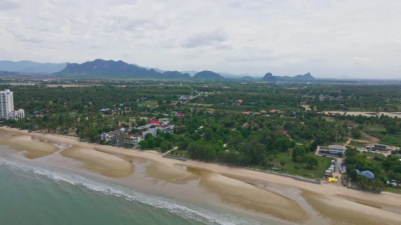Aerial View of Tropical Beach and Mountains