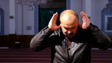 Middle-Aged-Man-Prays-in-Mosque-4