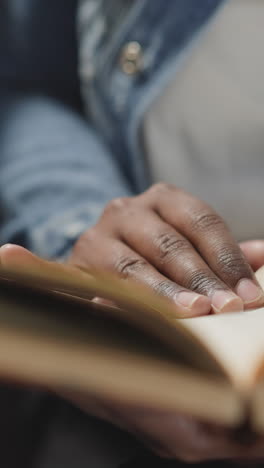 woman flips pages of textbook looking for information for student report at university. hands of female person holding subject book from library closeup