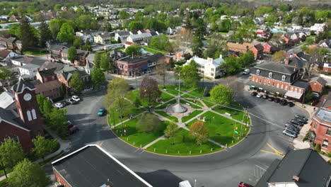 town in usa with american flag waving in breeze