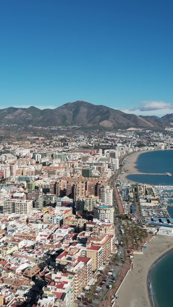 Fuengirola: Modern Cityscape with Mediterranean Architecture and Hills