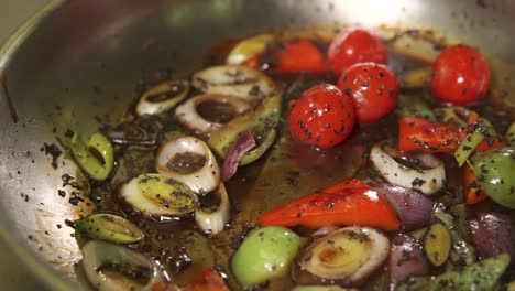 preparing a stir-fry dish in a pan