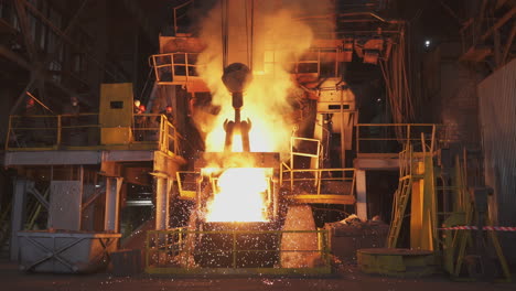 metal casting process in a foundry at night
