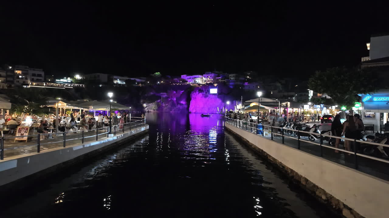 View of peoples relaxing in the ancient Venetian port of Rethymno at night, Crete,Greece