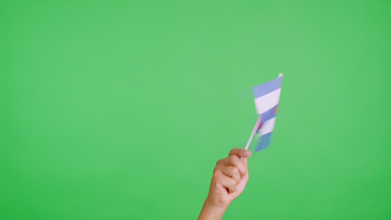 Hand waving a pennant of a cuban national flag